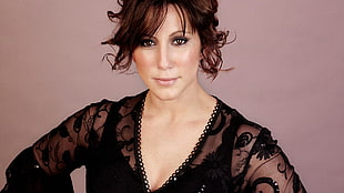 woman wearing black long sleeve top