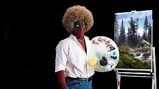 Deadpool holding painting