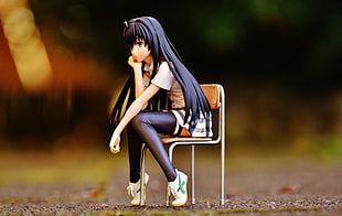 female anime character pvc sitting on chair