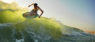 boy surfing board at day time HD wallpaper