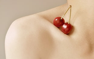 two cherries on collarbone