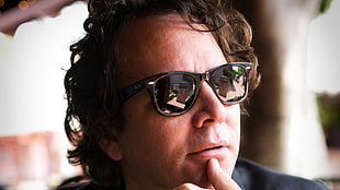 man in black frame Ray-ban wayfarer sunglasses