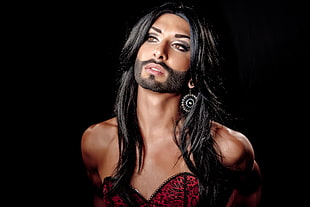 black-haired woman with artificial beard portrait