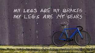 blue and black road bike with text overlay