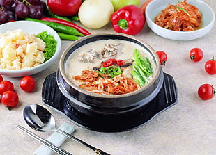 cooked foods on black ceramic bowl with tray