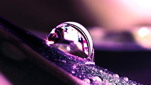 selective focus photography of silver-colored ring