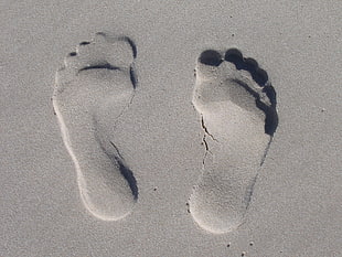 human foot prints in the sand