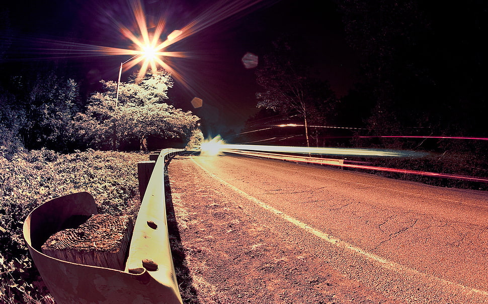 Concrete road during night tume HD wallpaper