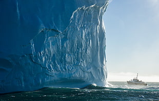 brown and grey ship near ice berg HD wallpaper
