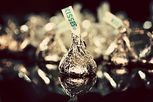 selective focus photography of Hershey's Kisses chocolate HD wallpaper