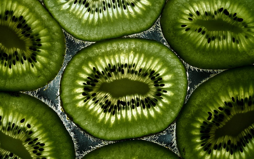 shallow focus of slice green kiwi HD wallpaper