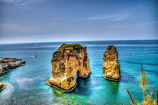 two yellow-and-black rock formation at blue sea under blue sky during daytime, beirut, lebanon HD wallpaper