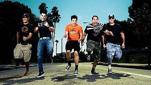 five men jumpshot photo on gray pavement HD wallpaper