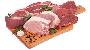 sliced meats on brown wooden chopping board