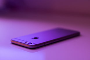 close up photo of silver iPhone 7 on pink surface