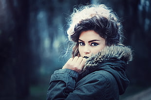 woman wearing black and brown parka