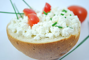 bread spread with white cheese and tomato