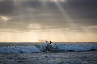 person surfing during daytime HD wallpaper