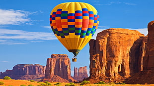 yellow and multicolored hot air balloon, glowing, hot air balloons