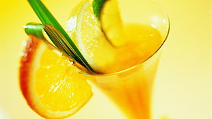 orange juice with slice orange fruit in clear drinking glass