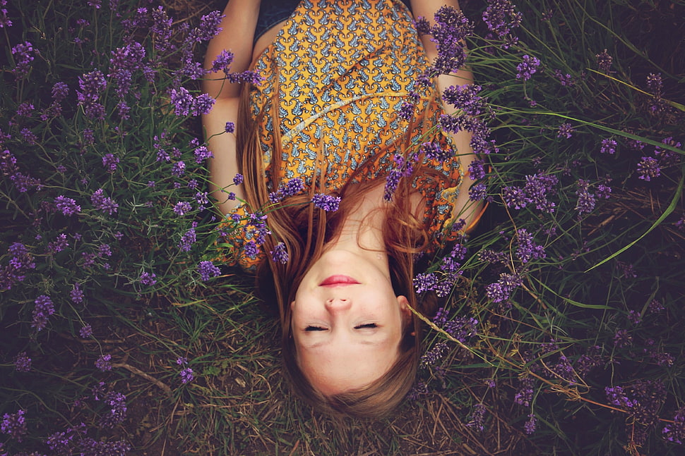 girl in yellow blouse lying on a purple flower field HD wallpaper