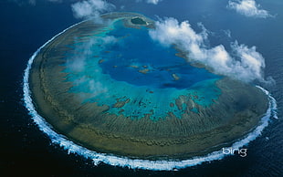aerial photography of island, sky, sea, water, coral