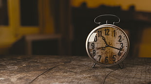round silver deck clock at 11:18