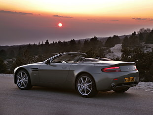 gray Aston Martin coupe during golden hour