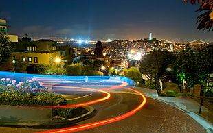 busy road in timelapse photography during night