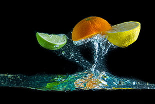 time lapse photo of sliced citrus fruit on water