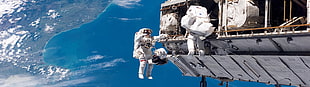 astronauts on spaceship during daytime
