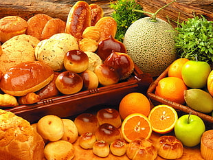 orange fruits beside granny smith apples