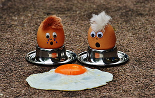 sunnyside up egg and two brown eggs