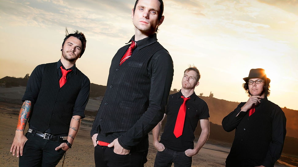 four person in black suit band HD wallpaper