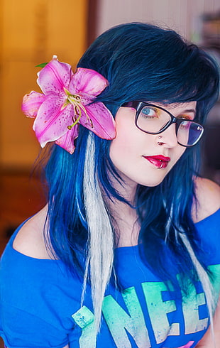 blue-haired woman with pink flowers on head