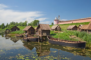 canoes near huts