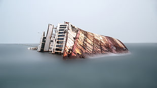 brown and white concrete building, water, ship, wreck