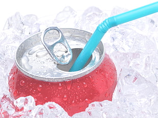 red and grey soda can with teal plastic straw