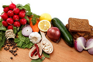 assorted vegetables on wooden surface