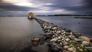 photo of gray stone dock with brown wooden shed during cloudy daytime, stavanger, norway HD wallpaper