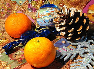 two orange citrus fruits