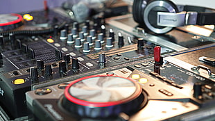 black DJ turn table, DJ, mixing consoles, headphones
