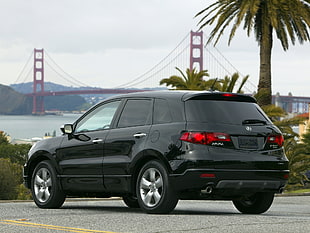 black SUV park near Golden Gate Bridge