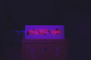 white and pink plastic toy, neon, boxes
