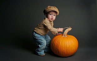 boy holding pumpkin photo