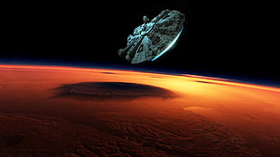 Star Wars Millennium Falcon above planet at nighttime