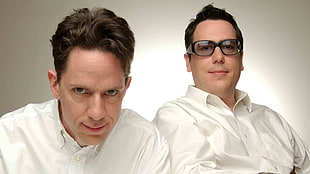 two men in white dress shirts