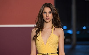 woman wearing yellow v-neck sleeveless dress