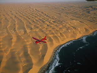 red biplane, airplane, aircraft, aerial view, dune HD wallpaper