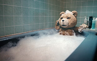 Ted on bath tub holding smartphone movie scene
